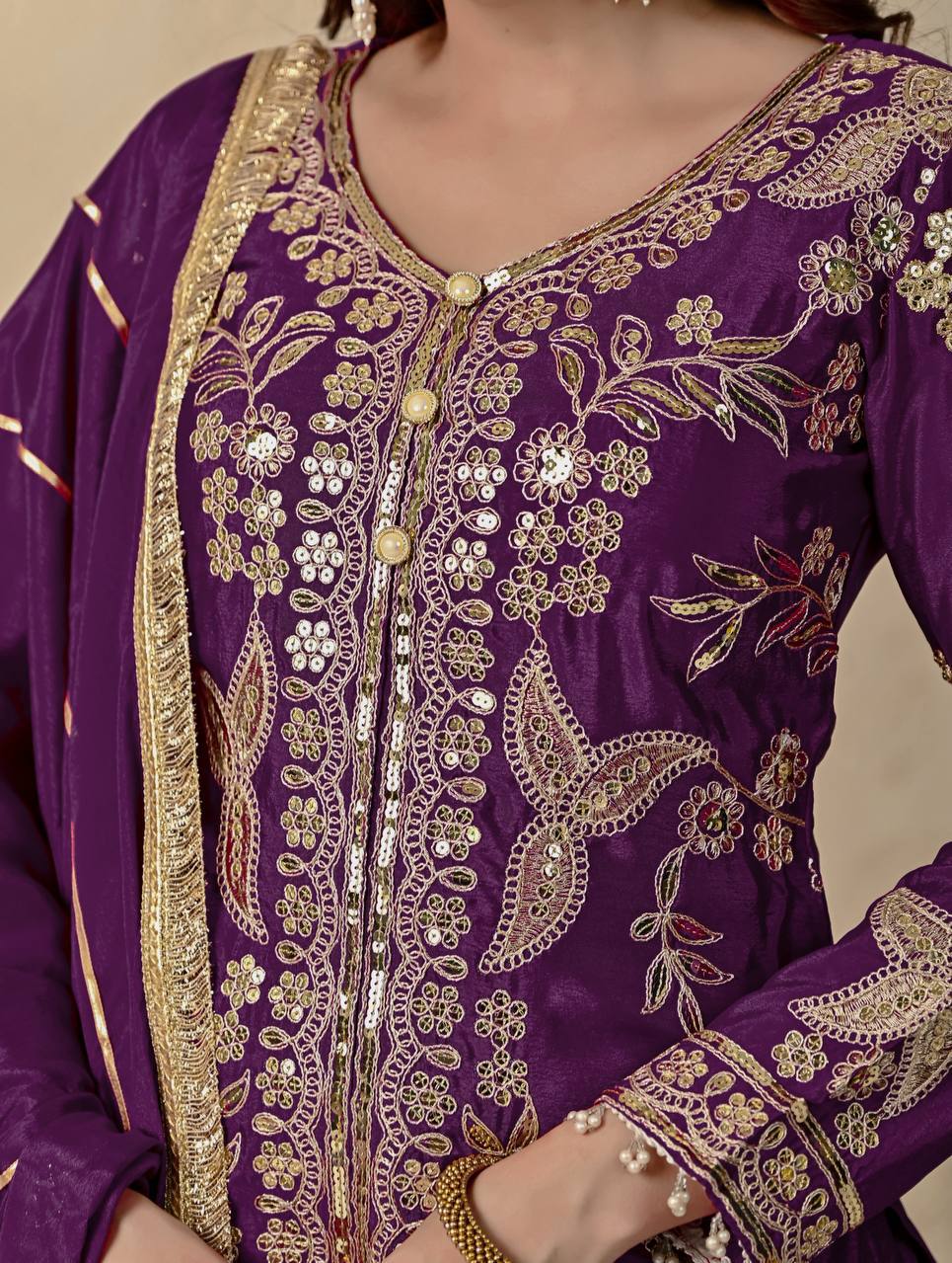Regal Wine Purple Kurti and Flared Palazzo Suit Set Embellished with Intricate Floral Zari and Mirror Work